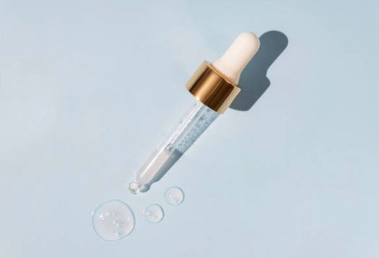 Dropper with retinol solution coming out.